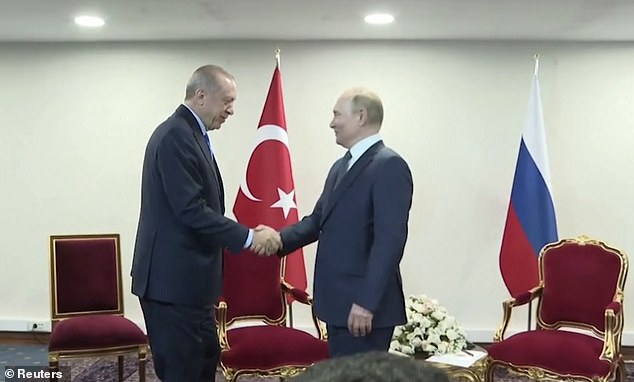 After almost a minute, Erdoğan appeared and an irritated-looking Putin shook his hand