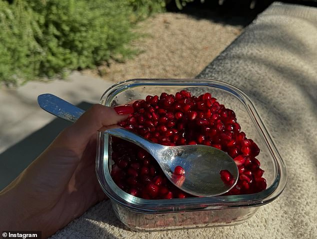 While spending time in the cooler California weather, Kylie had a tasty pomegranate snack