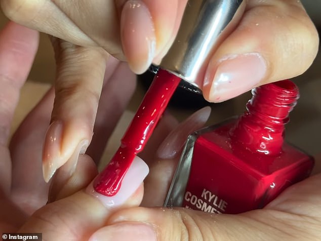 Finally, in the post, the beauty painted her nails a striking red color using nail polish from her brand Kylie Cosmetics which launched on Tuesday ahead of the holidays.