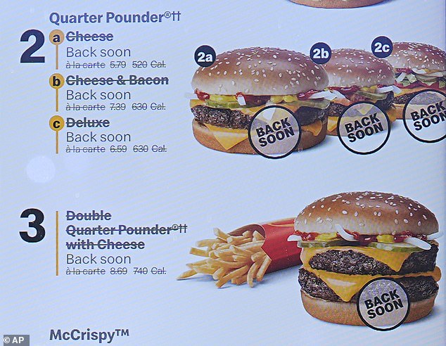 The Quarter Pounder has been removed from menus in ten states because it is suspected to be the source of an E.coli outbreak. Pictured is a menu board at a store in Colorado, which has recorded the highest number of cases