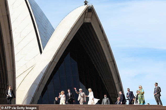 A sniper is seen on one of the sails as the king and queen arrived