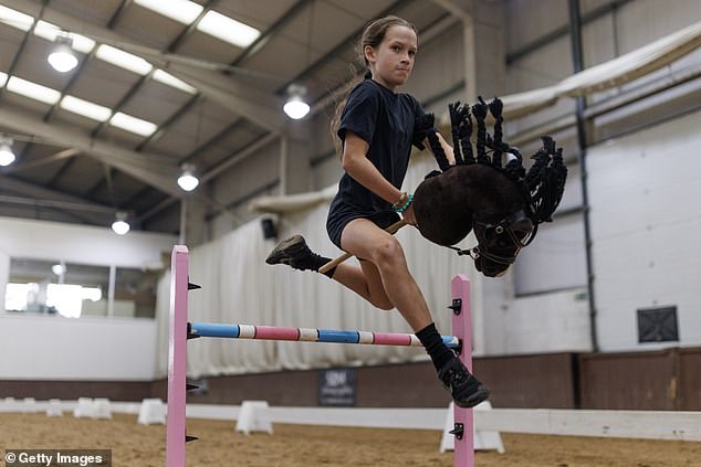 PETA wants organizers to ditch the wild horses and switch to letting jackaroos and jillaroos ride hobby horses, like this participant in the UK Hobby Horse Championship