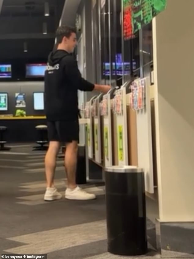 Scarf is pictured taking a bet at his local TAB in Sydney - and he says his girlfriend and family would rather 'bury their heads in the sand' than take his wild gamble