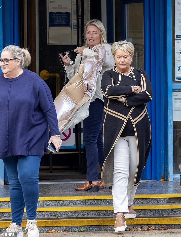 Nicola Hewitson, 56, (pictured centre) lurked outside a Tesco supermarket before speeding the £35,000 B-class model off Michelle Jennings as she emerged from the store with a trolley full of groceries.