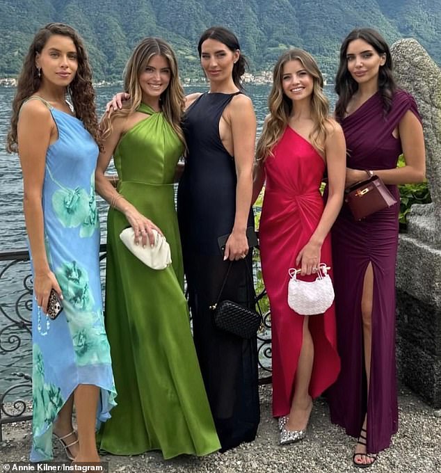 Annie (middle) pictured with friends at the Italian wedding. She is currently in the process of divorcing the Manchester City and England star