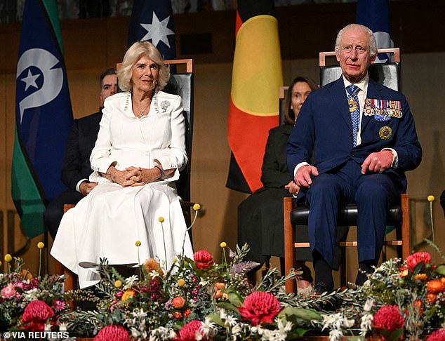 King Charles (pictured right) sits with Queen Camilla during the reception, interrupted by Senator Thorpe