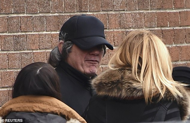 Gerry Hutch wears a disguise as he leaves after attending the funeral service for his brother Eddie Hutch, at the Church of Our Lady of Lourdes in Dublin, Ireland, February 19, 2016