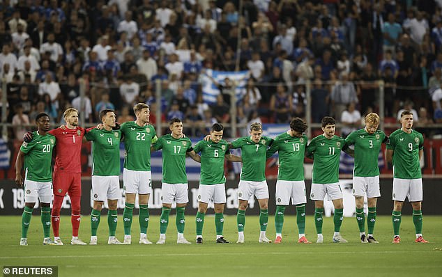 Ireland players pictured during a minute's silence before their match in Piraeus