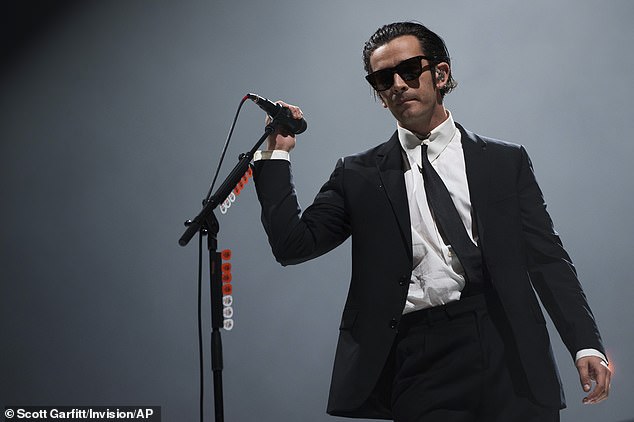 The lyrics also refer to a man in a 'Jehovah's Witness suit' and 'rust my sparkling summer', with Matty known for wearing striking black suits during live performances (seen in 2022)