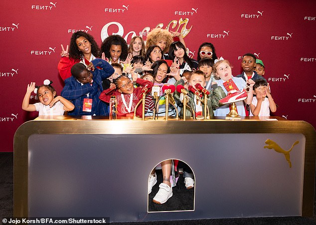 At one point, the nine-time Grammy winner - who has two sons under the age of two - made a funny face while surrounded by children, as her shoes come in all sizes.