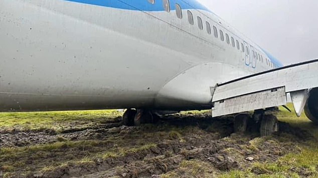 The photos show the plane stuck in thick mud after sliding off the runway during landing. No one was injured in the crash