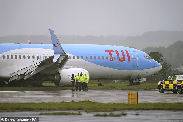 Emergency services on the scene after the passenger plane came off the runway at Leeds Bradford Airport