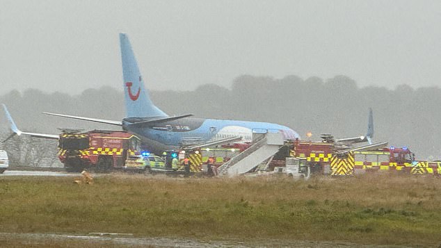 The horrific conditions can be seen as firefighters and ambulances surrounded the plane