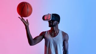 A basketball player playing with the ball while wearing a virtual reality headset