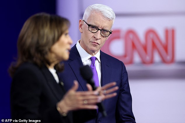 CNN's Anderson Cooper (center) watches Vice President Kamala Harris (left) answer a question Wednesday evening during a town hall event in suburban Philadelphia aimed at undecided voters