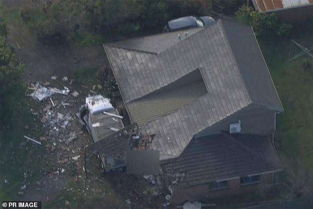 The impact caused shards of glass and debris to spread across the garden