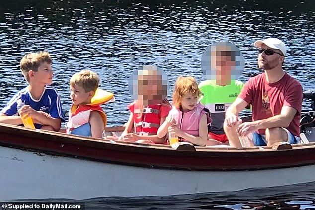 The couple's eldest son, 15, (in green) is accused of killing his parents, two brothers and one of his two sisters. The surviving sister, 11, (in red) was shot twice and is now in hospital. The siblings are depicted with their father in happier times