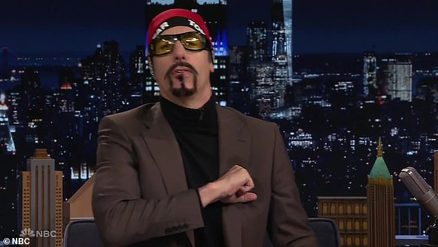 As the crowd cheered, he first transformed into Ali G, with a stuffed goatee, red hat and glasses, when Fallon asked him to moderate a debate between Trump and Harris.