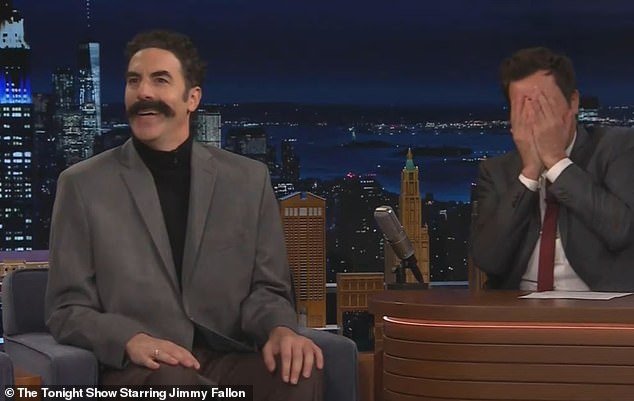 Cohen then donned a gray suit jacket and a mustache as he transformed into Borat, before attempting to kiss Fallon