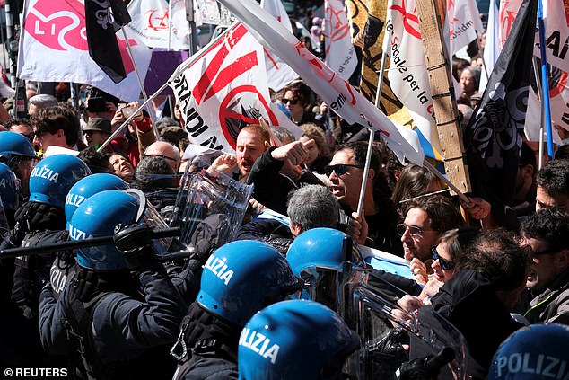 People clash with police as they protest the introduction of the registration and tourist tax in Venice, Italy, April 25, 2024