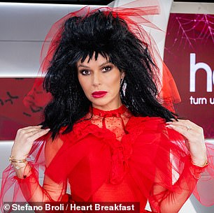 Amanda dressed up as the character of Lydia, with a dramatic black wig and a red tulle dress