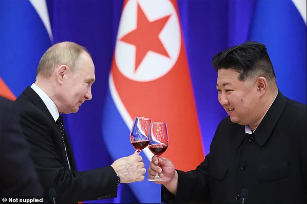 Putin and Kim clash glasses during the former's visit to Pyongyang