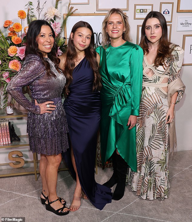 Kat Samick in green poses with Adriana Parsons, Stella Parsons and Micheli Lima