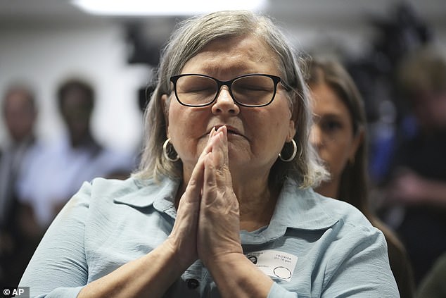 Kitty Hernanedez's niece Diane held her hands to her face and closed her eyes prior to the announcement