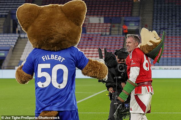 The Liverpool legend was in good spirits before sharing a cheeky grin at Filbert the Fox