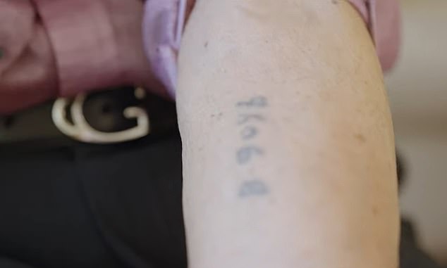 Holocaust survivor Jerry Wartski reveals his tattoo in Auschwitz prison