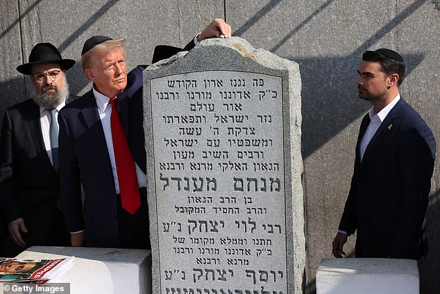 Former Republican presidential candidate Donald Trump prays at the grave of Rabbi Menachem Mendel Schneerson, at Ohel Chabad-Lubavitch, Monday, Oct. 7, 2024, in New York.