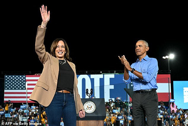 Former US President Barack Obama cheers on US Vice President and Democratic presidential candidate Kamala Harris during a campaign rally at James R Hallford Stadium in Clarkston, Georgia on October 24, 2024