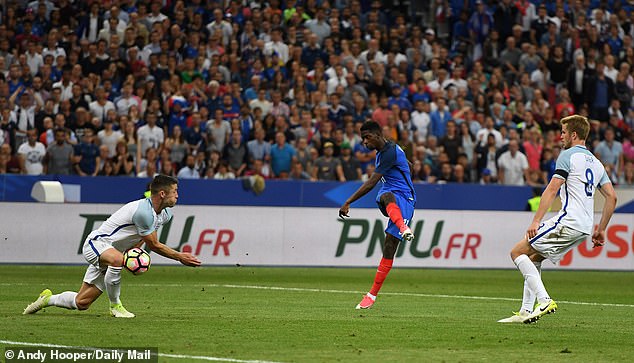 Ousmane Dembele (centre) photographing a goal for France against England in June 2017