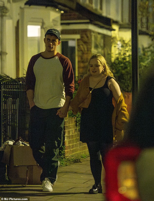 The couple were photographed holding hands as they went on a fun date at an Irish bar