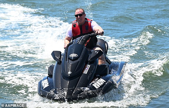 Queensland Premier Steven Miles is seen riding a jet ski at the Gold Coast Broadwater in Southport on the Gold Coast, Friday, October 25, 2024. The Queensland election will be held on October 26. (AAP Image/Darren England) NO ARCHIVING