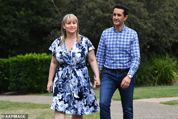 Opposition Leader David Crisafulli (right) and wife Tegan vote at Springwood State High school, during election day in Brisbane, Saturday, October 26, 2024. Queensland voters go to the polls to choose the state's next leader after an eventful, election campaign of four weeks. (AAP Image/Jono Searle) NO ARCHIVING