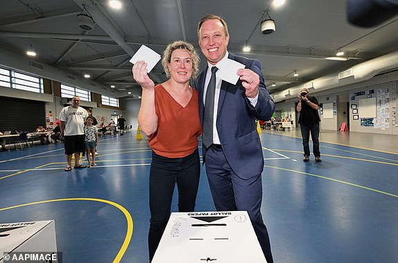 Queensland Premier Steven Miles and his wife Kim vote at Kallangur State School during election day in Brisbane, Saturday, October 26, 2024. Queensland voters go to the polls to choose the next state leader after an eventful four-week election campaign. (AAP Image/Darren England) NO ARCHIVING