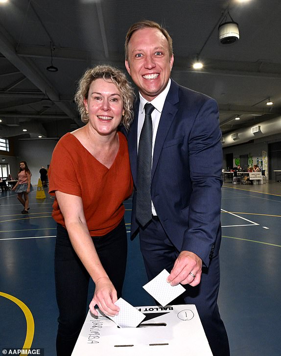 Queensland Premier Steven Miles and his wife Kim vote at Kallangur State School during election day in Brisbane, Saturday, October 26, 2024. Queensland voters go to the polls to choose the next state leader after an eventful four-week election campaign. (AAP Image/Darren England) NO ARCHIVING