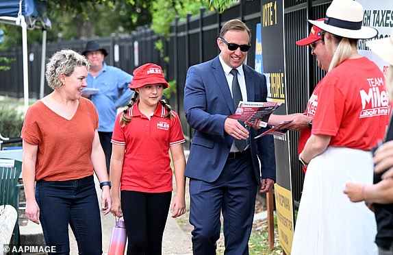 Queensland Premier Steven Miles, his wife Kim and daughter Bridie arrive to vote at Kallangur State School during election day in Brisbane, Saturday, October 26, 2024. Queensland voters go to the polls to choose the state's next leader after a eventful election day. , four-week election campaign. (AAP Image/Darren England) NO ARCHIVING