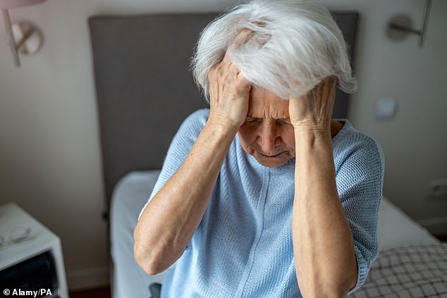 Analysis suggests that the posture people adopt while using their devices can reduce blood flow to the brain, leading to cognitive decline (Stock Image)