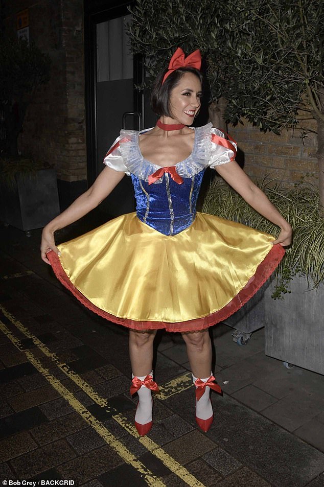 The former Strictly star wore a yellow and blue mini dress, complete with heels and a bow headband