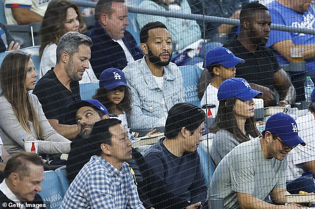 Singer John Legend was also at the game, sitting with his children at Dodger Stadium