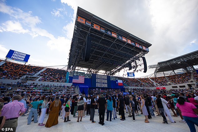 Supporters waiting at Shell Energy Stadium in Houston sign that