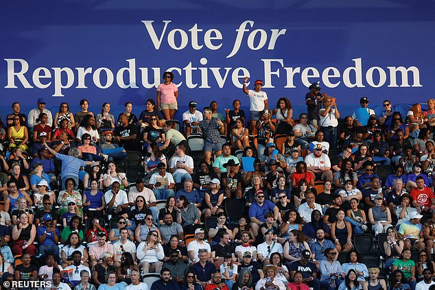 A giant sign at the Kamala Harris rally read 'vote for reproductive freedom'