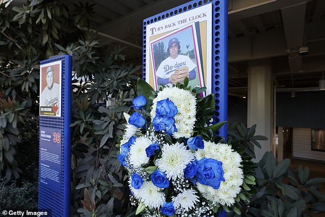 A blue and white wreath was hung from a plaque of the former Dodgers pitcher