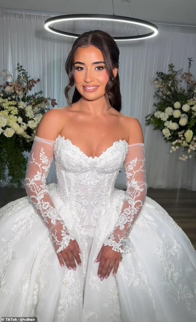 The bride, meanwhile, opted for a breathtaking white princess dress with a sweetheart neckline and lace sleeves