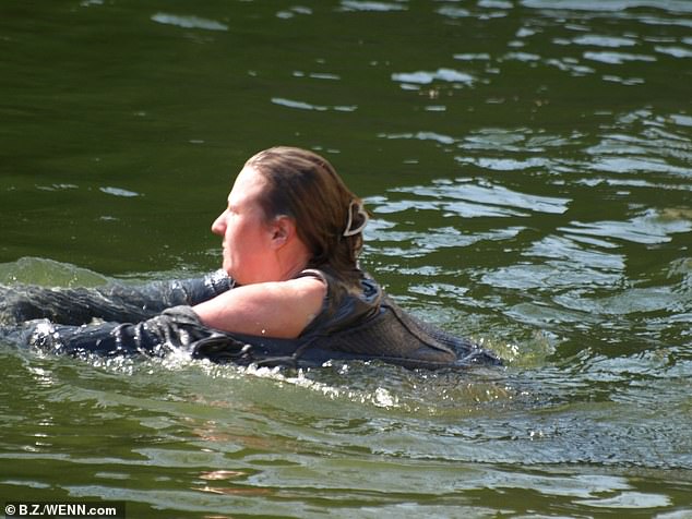 To the shock of onlookers, a 32-year-old woman was now in the exhibit and swimming towards the polar bears