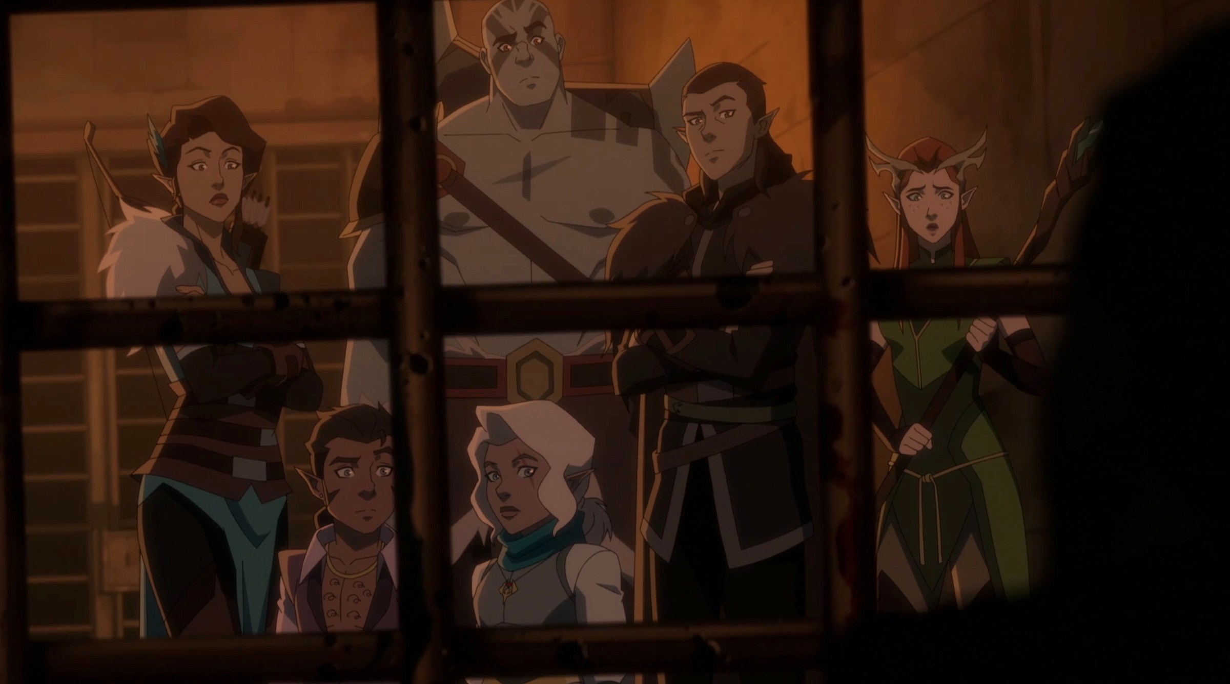 The member of Vox Machina stands outside a darkened prison cell, with several doubtful or concerned looks on their faces in season 3 of The Legend of Vox Machina