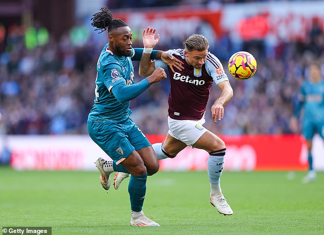 Villa's Matty Cash (right) and Bournemouth's Antoine Semenyo fight for the ball