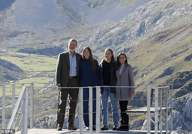 Spain's King Felipe (left), Queen Letizia (right), Crown Princess Leonor (second from right) and Princess Sofia pose during their visit to the village of Sotres